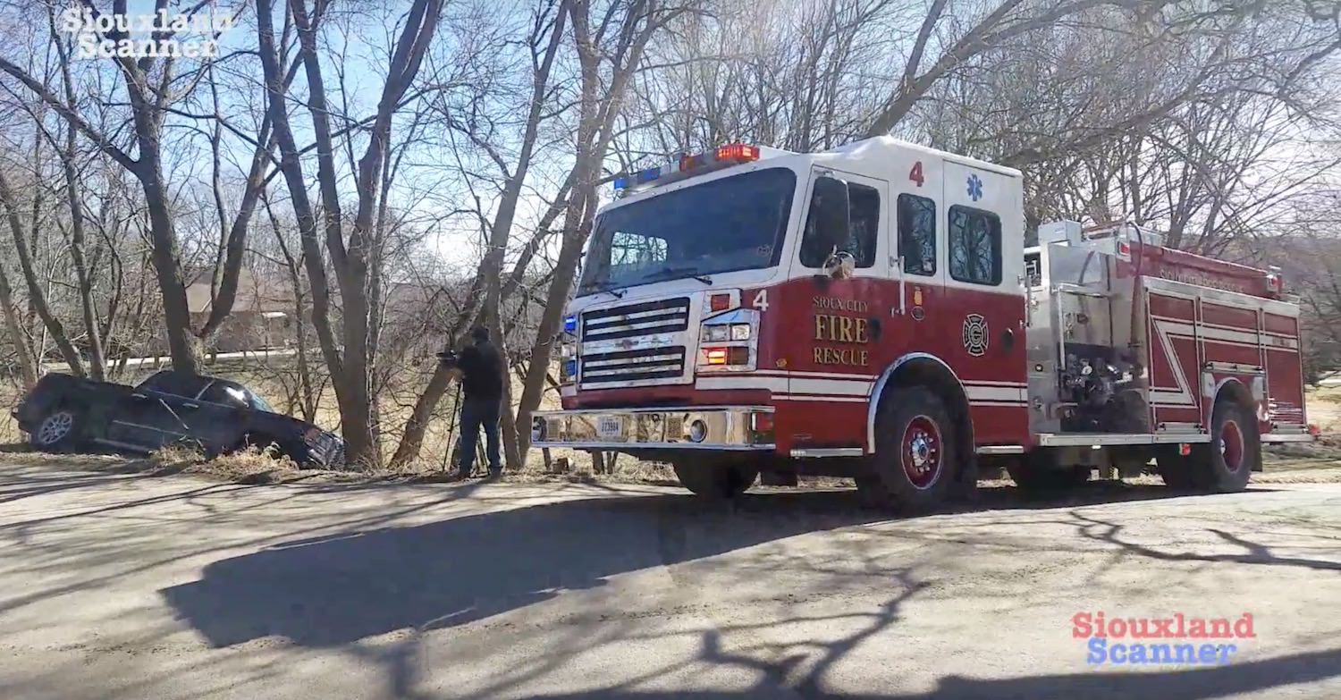 Truck backing up slides off road