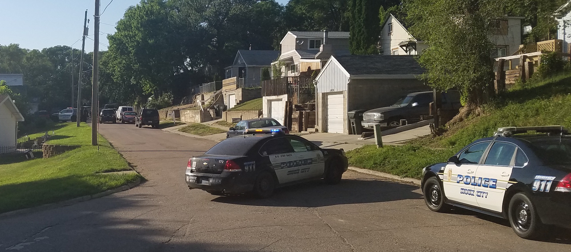 Police surround home after reports of shots fired