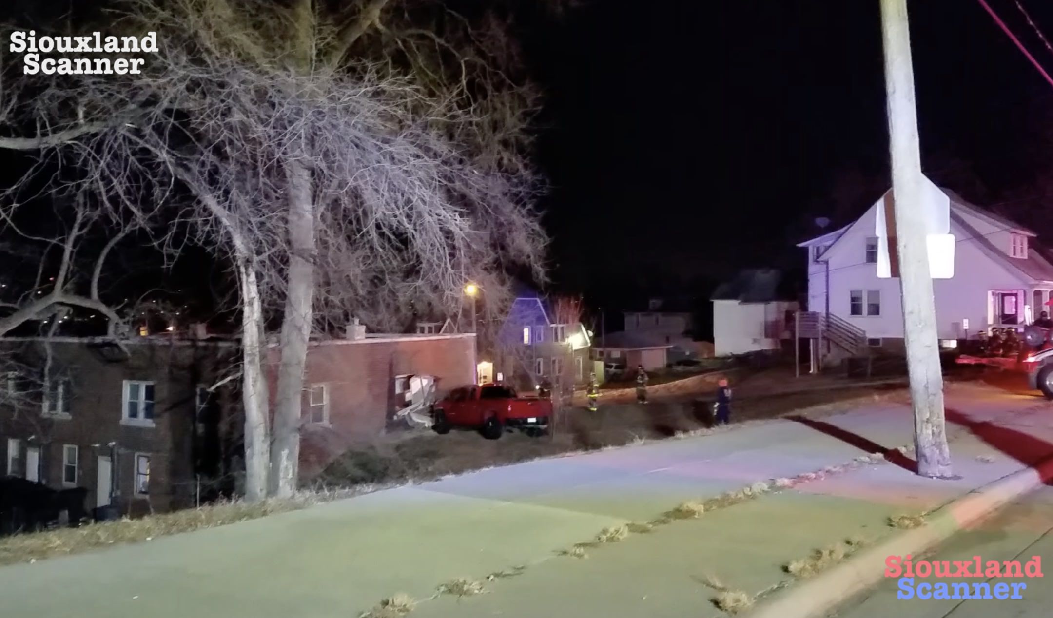 Truck crashes through apartment building breaking gas line