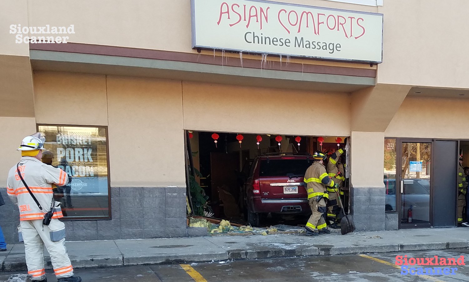 Jeep crashes into Asian Comforts Building