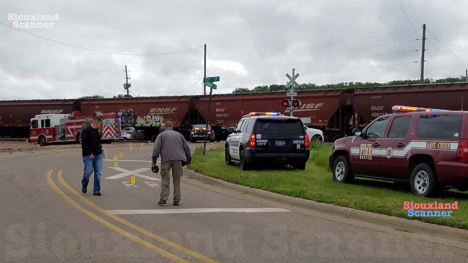 Police say male driver has died after vehicle collides with train